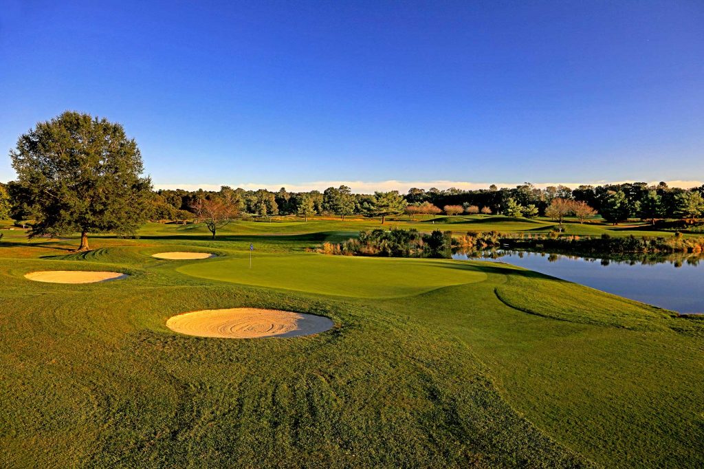 Bunkers and pond next to golf course