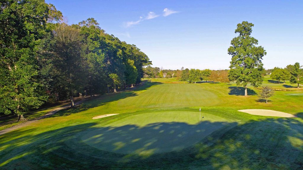 Golf course next to the tree line