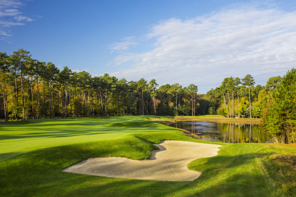 Bunker and pond next to golf course