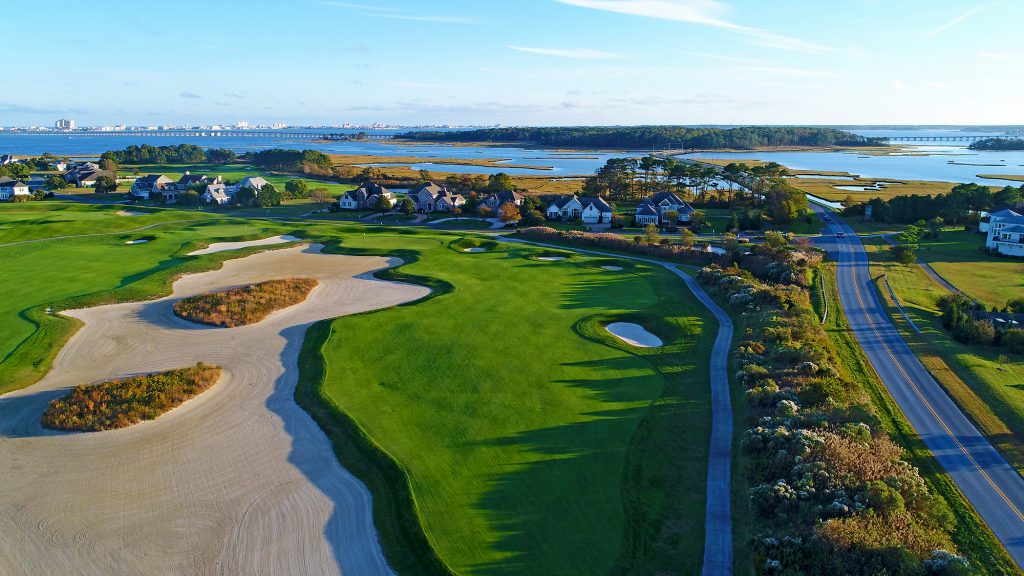Aerial view of golf course next to water